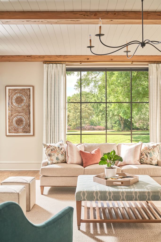 Iron glass windows inside a living room with a view outside.