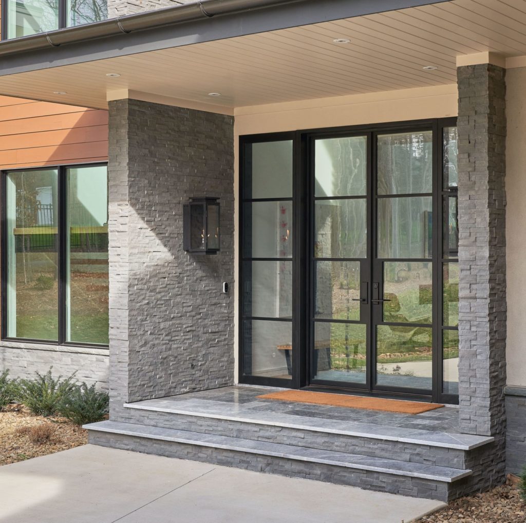 Modern glass front door with mid-century modern architecture.
