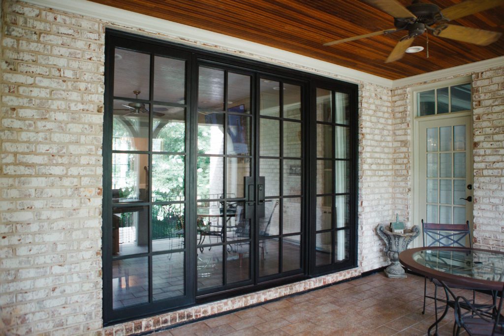 Modern glass doors leading out to patio.