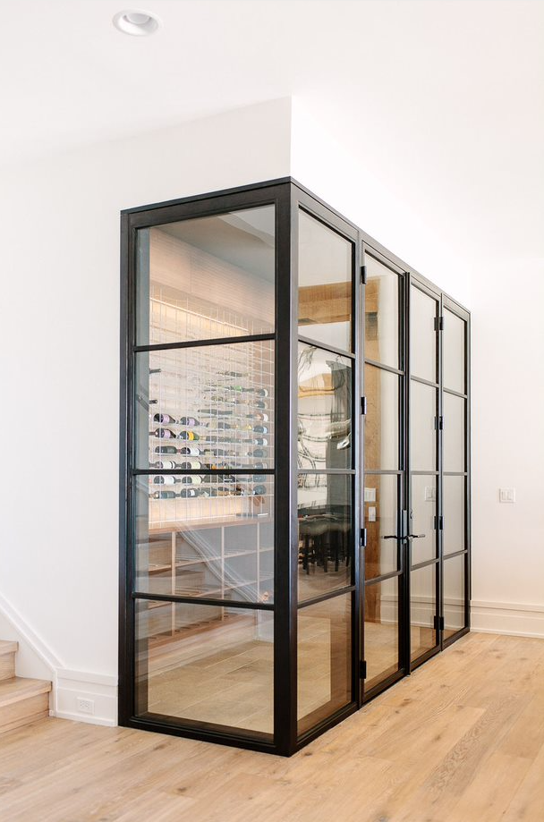 A wine cellar equipped with custom iron doors