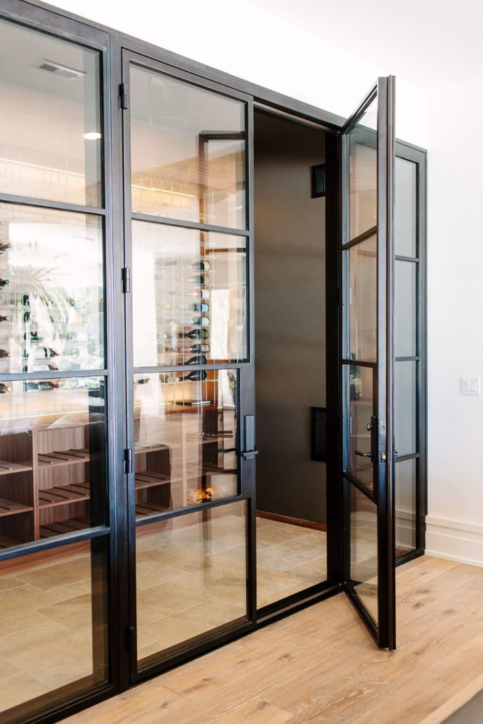 Wine cellar door with glass slightly open.