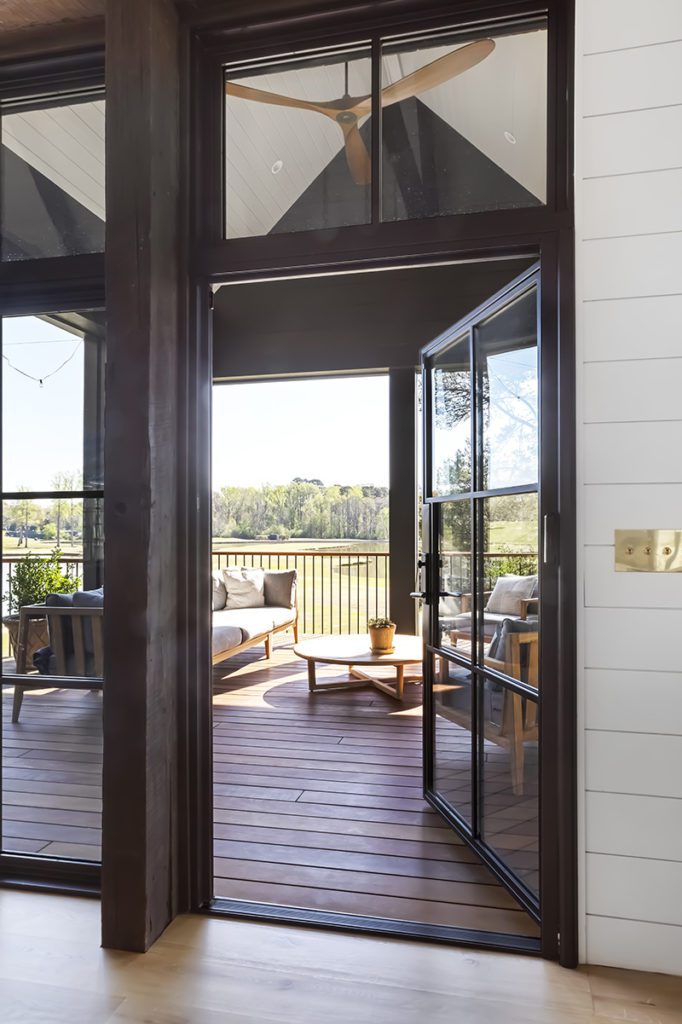 Open iron door leading out to back patio.