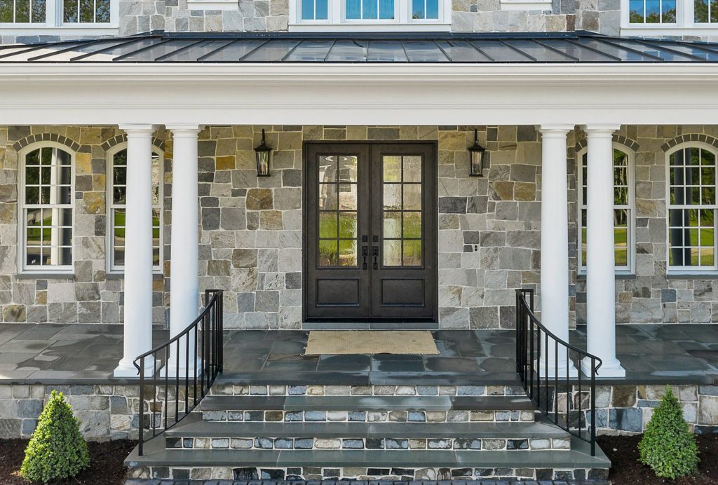 Traditional double door with stone exterior