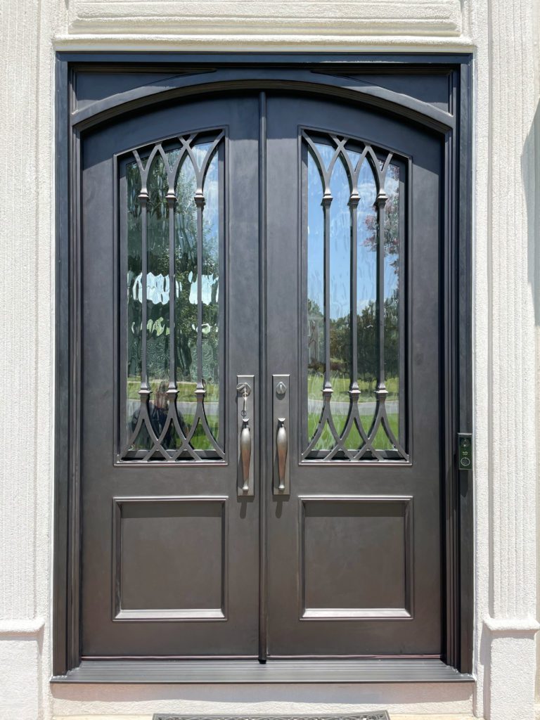Traditional iron doors with lines on windows