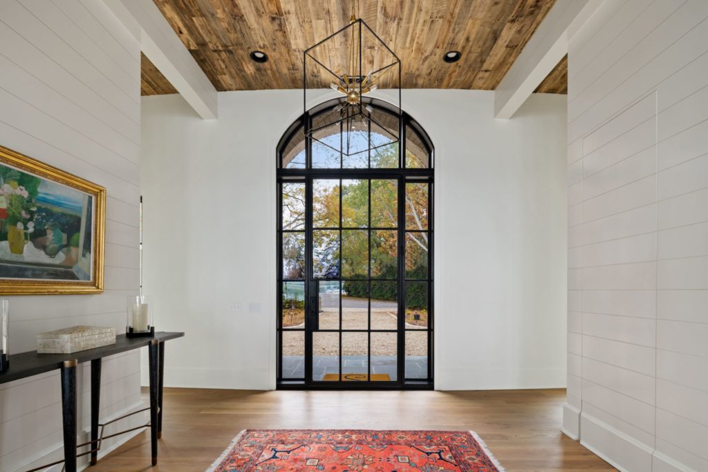 Modern door entryway with sidelights and transom.