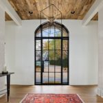 Modern door entryway with sidelights and transom.