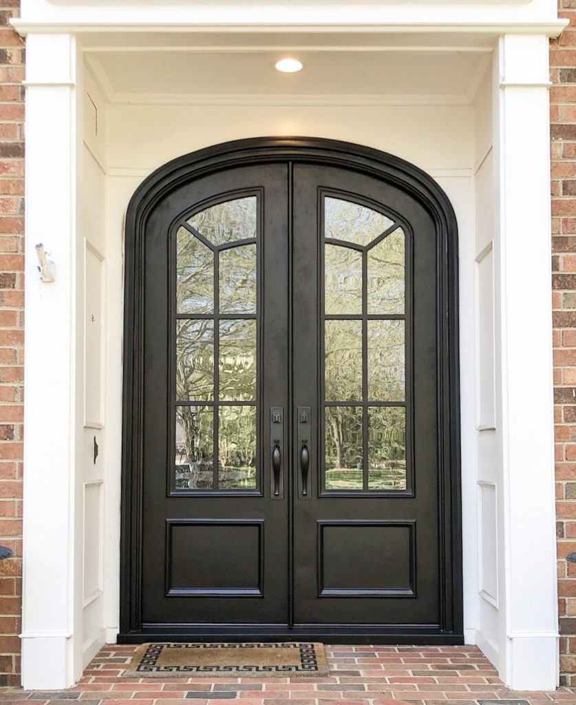 Double door entryway with textured glass.