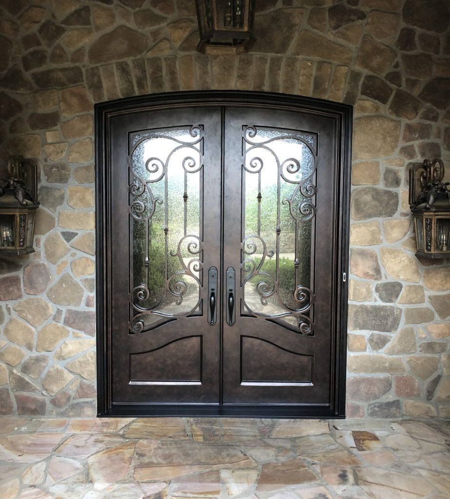 Custom iron door with segmented arch