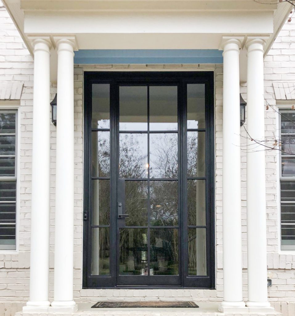 Modern door with sidelights with columns.