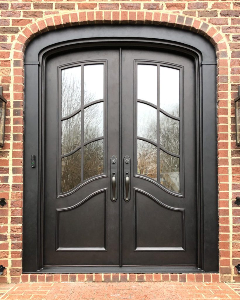 Traditional doors in a segmented arch