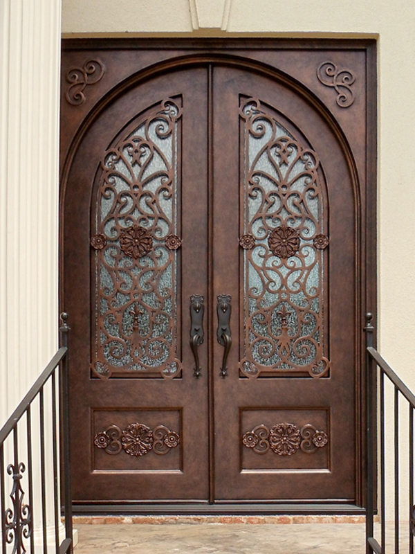 Ornate door with light cinnamon finish.