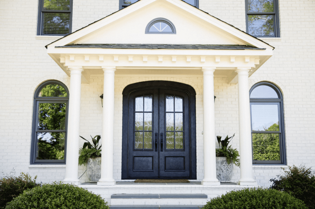 A double iron door featuring a charcoal finish.