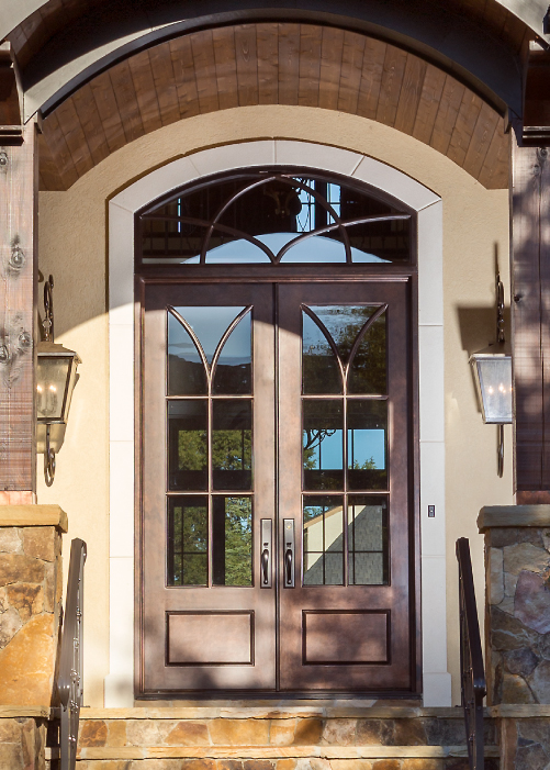 A traditional double door with a transom window.