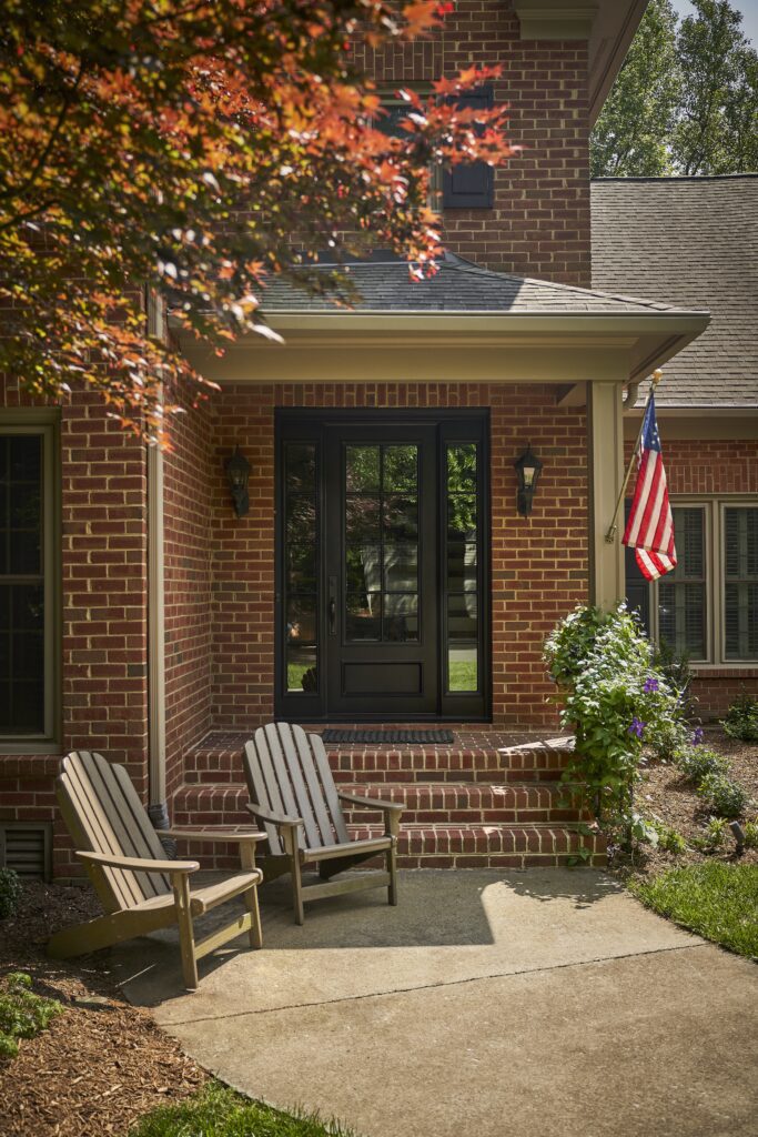 A front porch with a traditional door style.