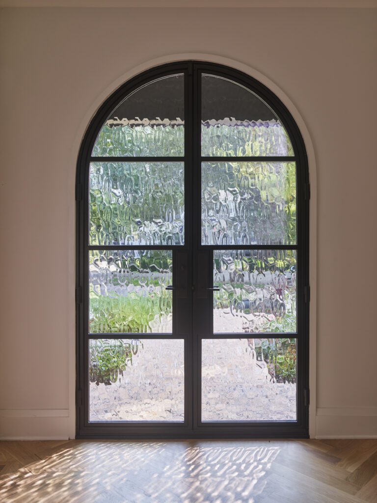 Hilary Farr's custom modern door featuring Flemish glass.