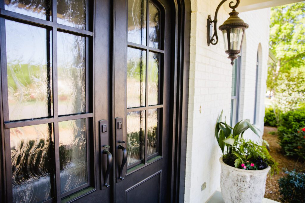Modern iron door with textured Seedy Baroque glass