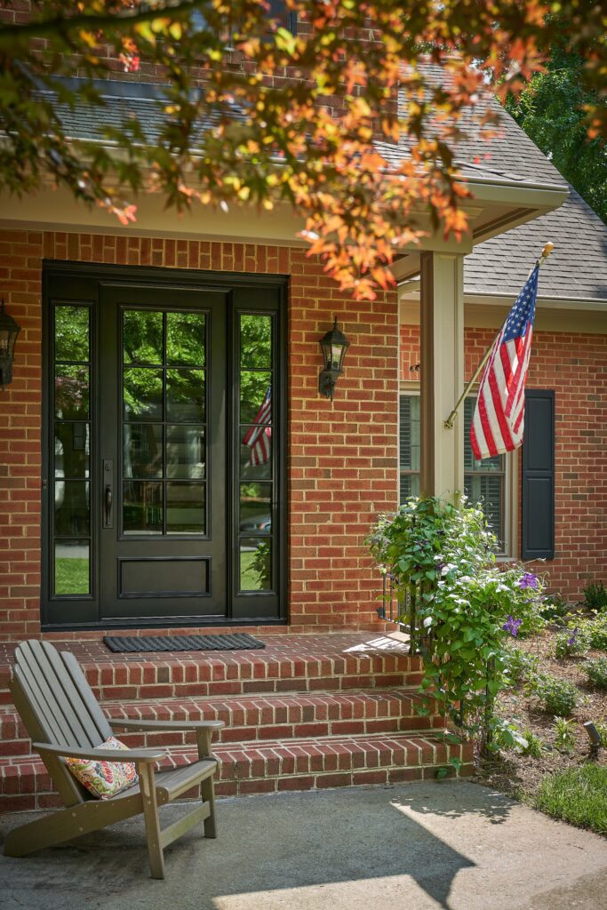 Traditional iron door in American house with flag