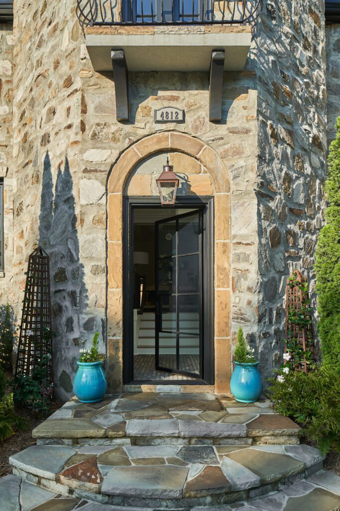 Modern iron glass door in stone house