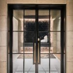 A modern double door with large glass windows.