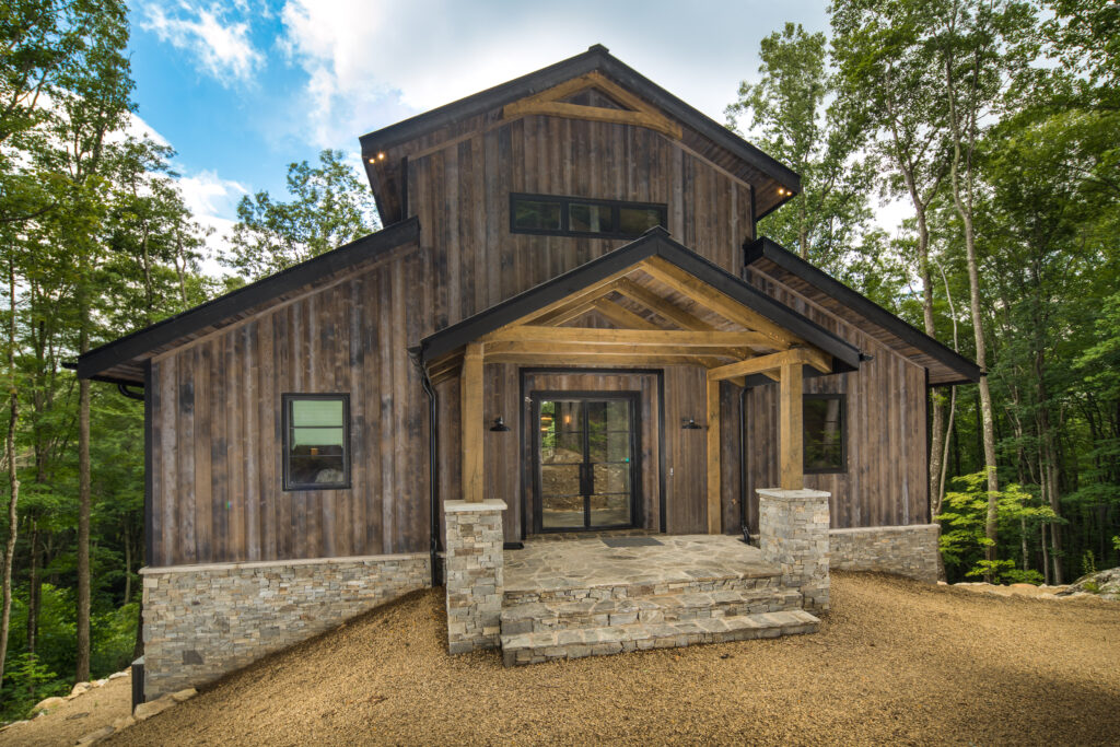 Rustic Modern Mountain barn style home with minimal grid front double doors