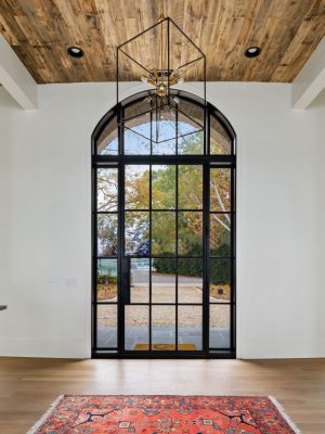 Modern door entryway with sidelights and transom.