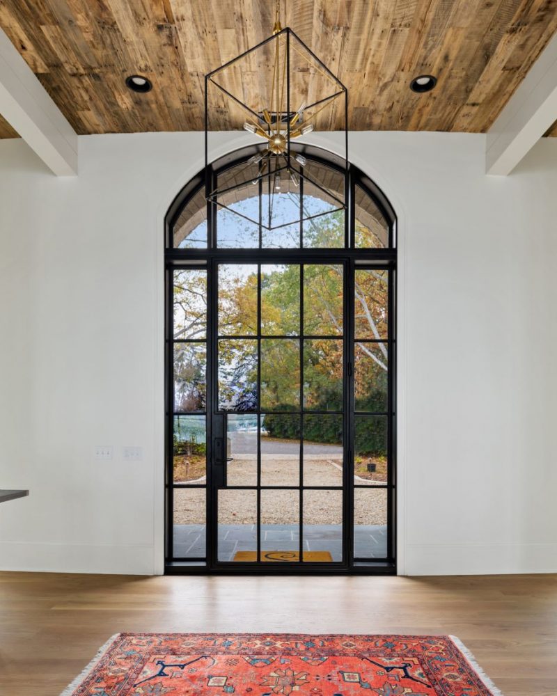 Modern door entryway with sidelights and transom.